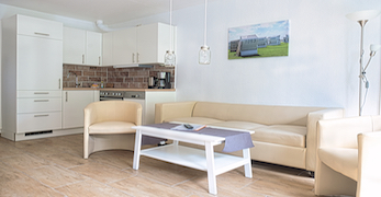 Ferienwohnung Wohnbeispiel E - Wohnzimmer